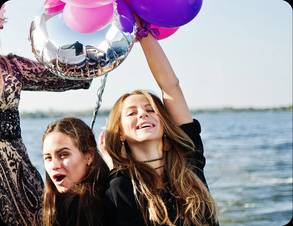 Friends celebrating a birthday on an Auckland yacht