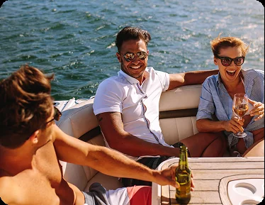Friends enjoying a Christmas celebration aboard a yacht